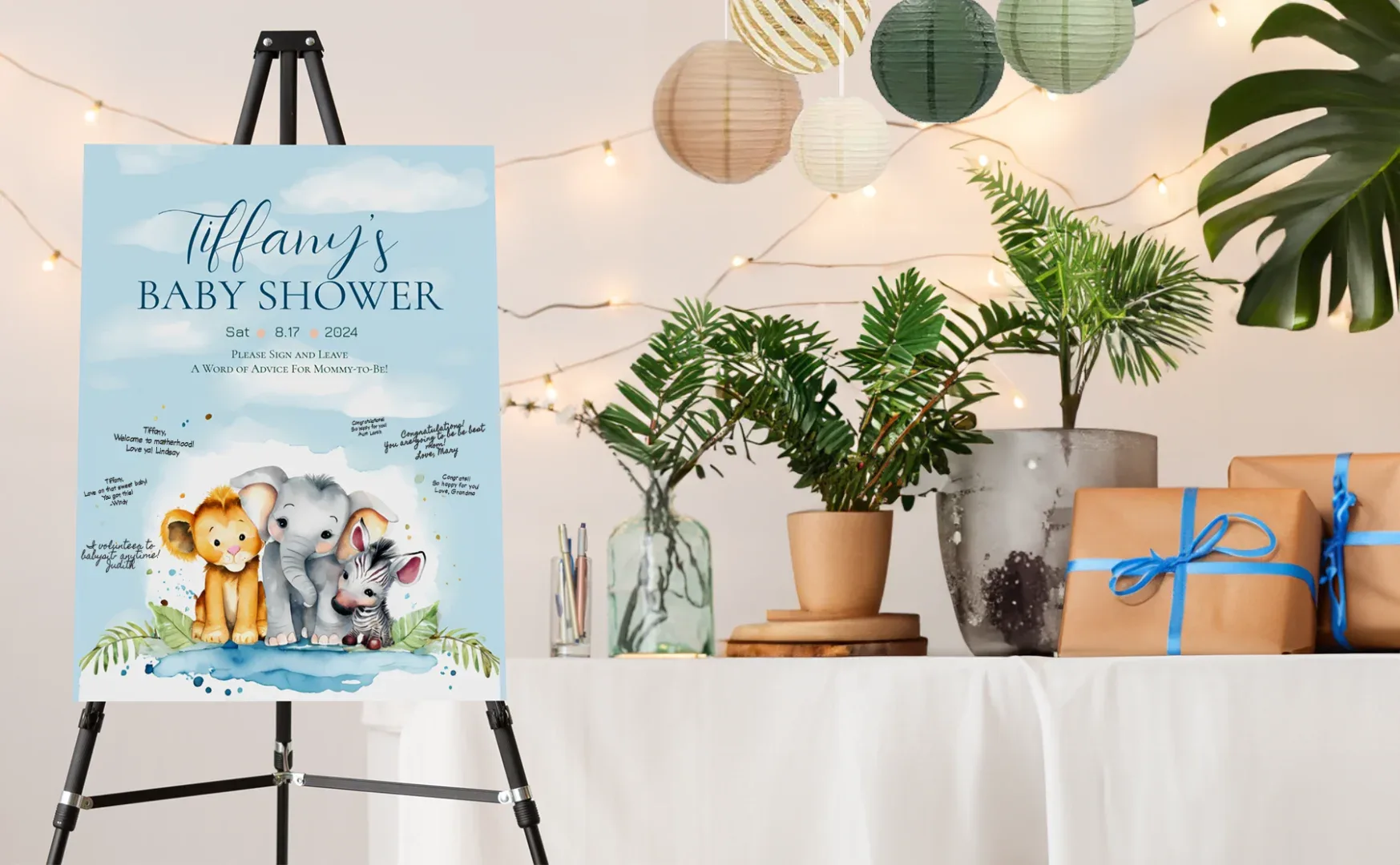A safari themed baby shower with a sign and table with plants and presents.