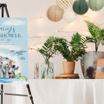 A safari themed baby shower with a sign and table with plants and presents.