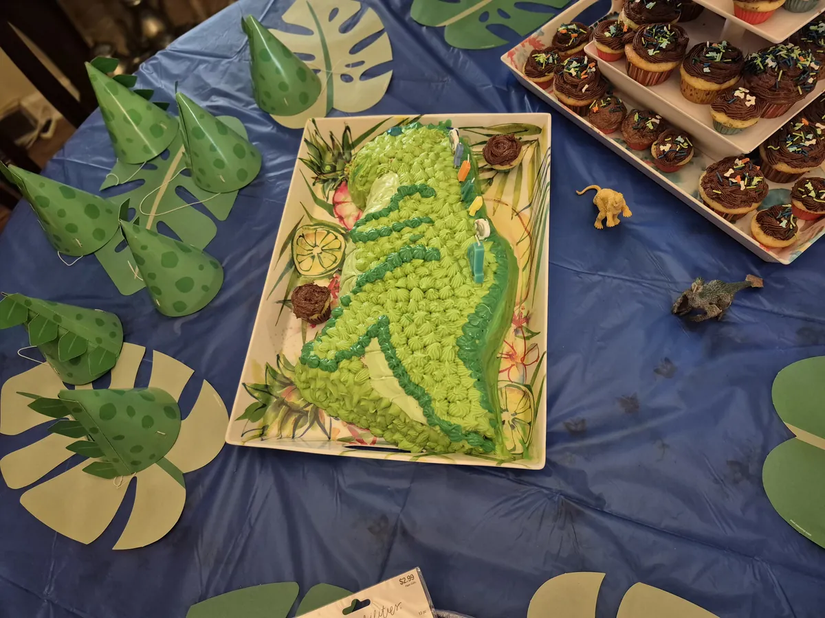 Green dinosaur birthday cake